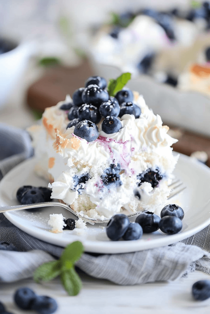 Serving Blueberries and Cream Angel Food Cake Dessert