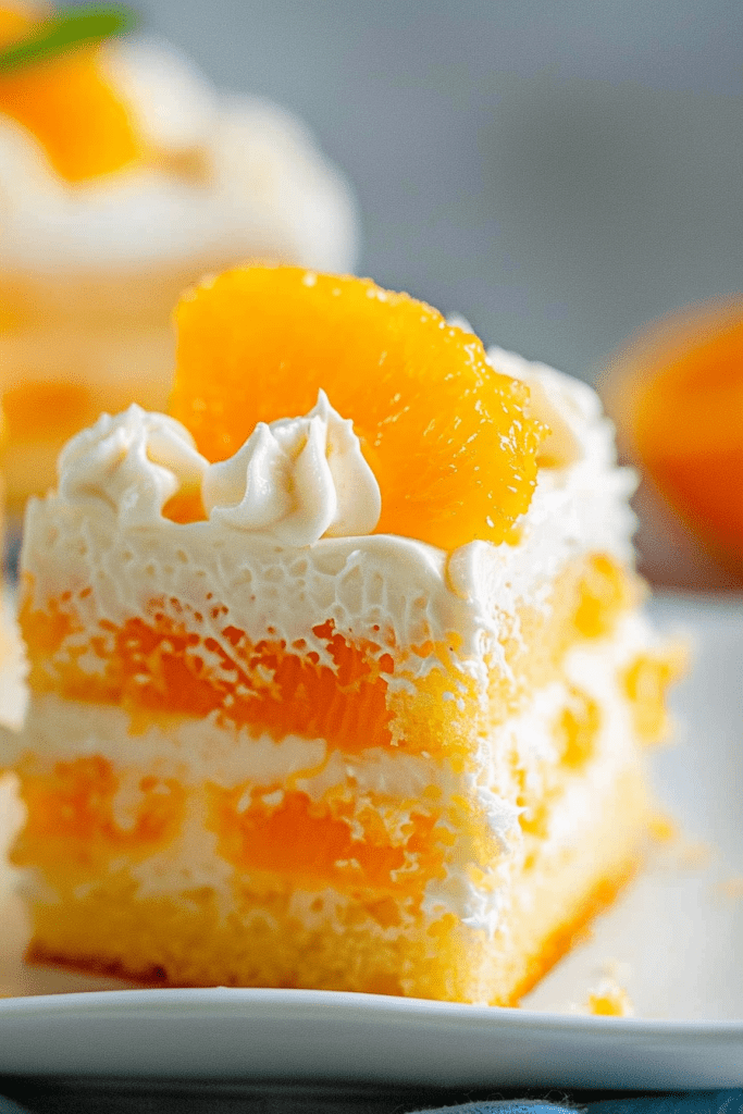 Serving Orange Creamsicle Poke Cake