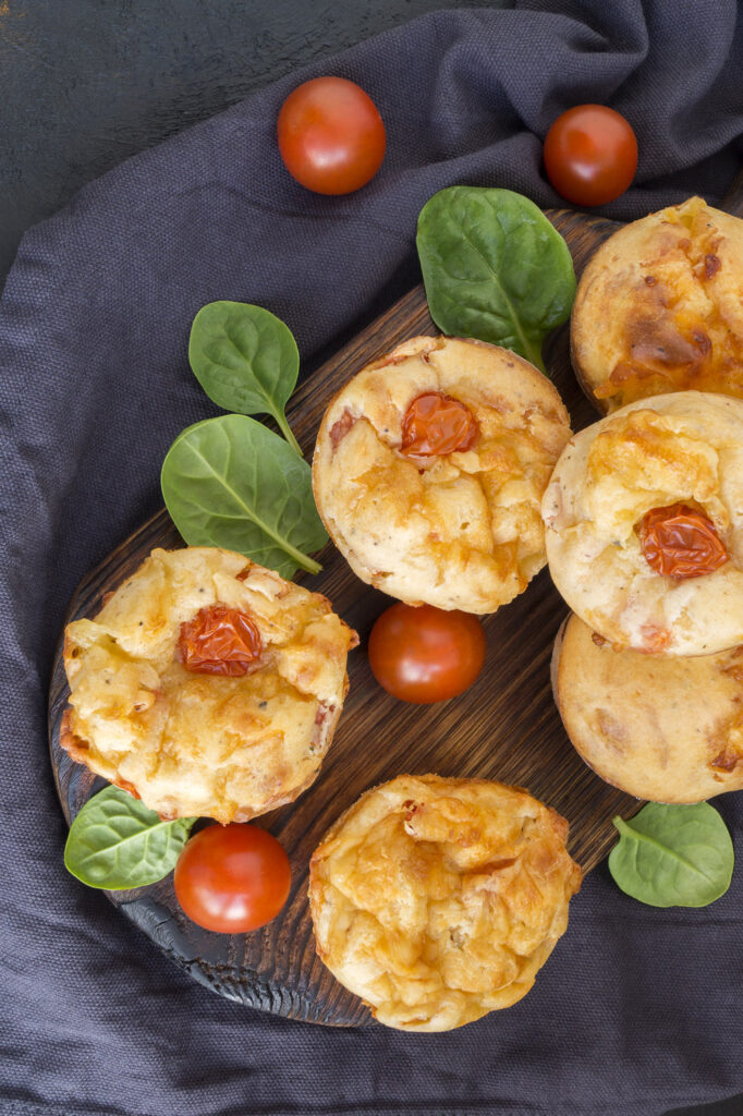 Assembling the Savory Cheese and Tomato Muffins