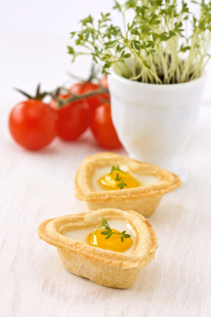 Serving Mini Egg and Herb Tartlets