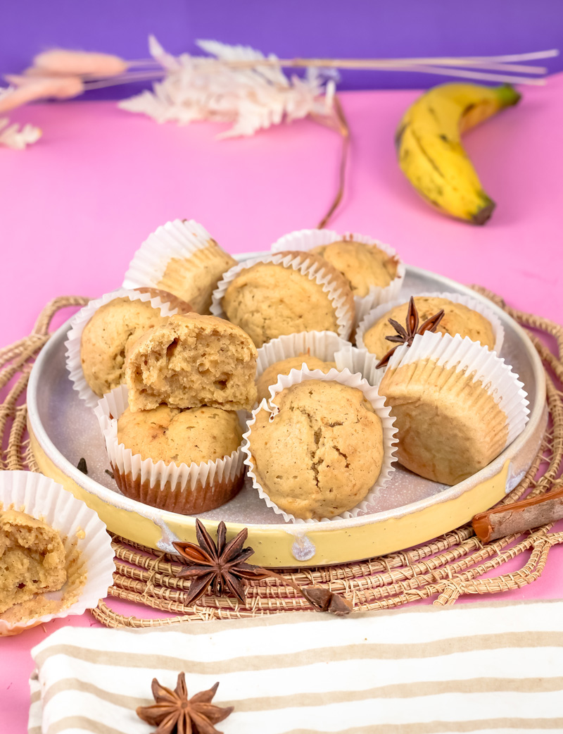 Fresh mini banana muffins with star anise decoration on stylish serving plate