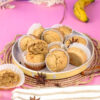 Mini banana muffins with ripe banana and spices on woven placemat