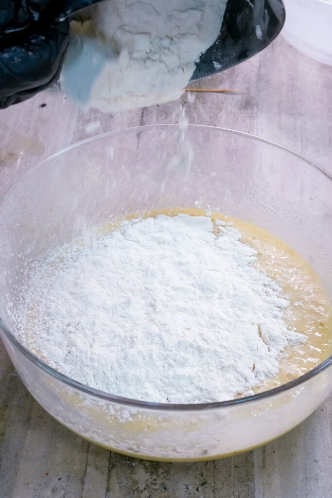 Adding flour to banana muffin wet ingredients