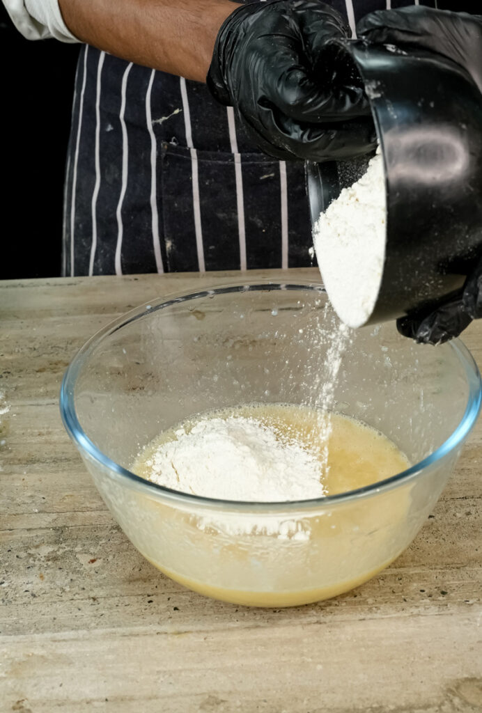 Adding flour to wet ingredients for healthy oatmeal muffins