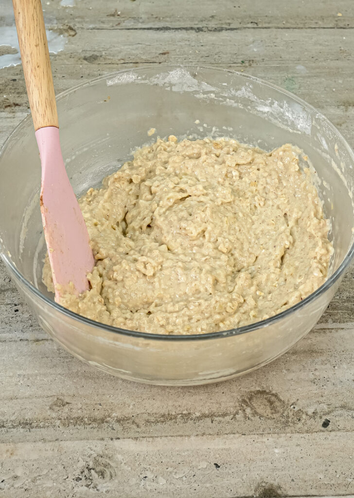 Applesauce muffin batter with oats in mixing bowl