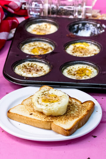 Baked eggs in muffin tin with egg on toast