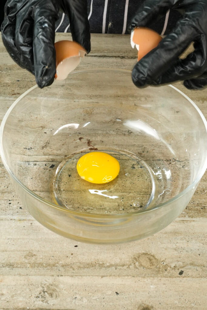 Cracking egg for chocolate muffin batter