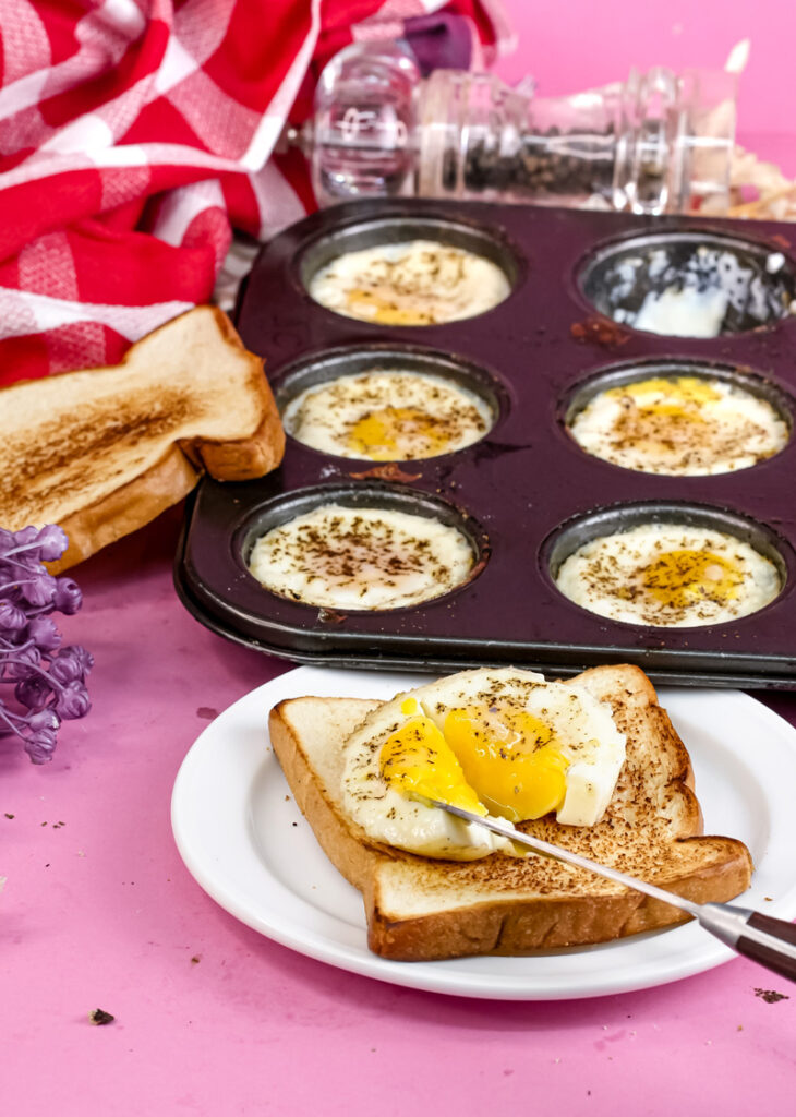 Cutting into runny yolk muffin tin egg on toast