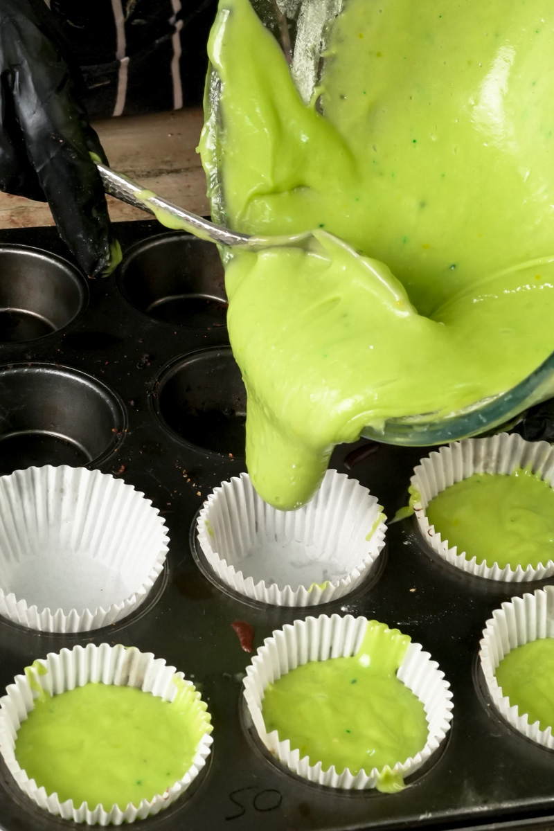 Filling muffin tin with pistachio batter
