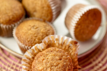 Close-up of moist applesauce muffin in paper liner