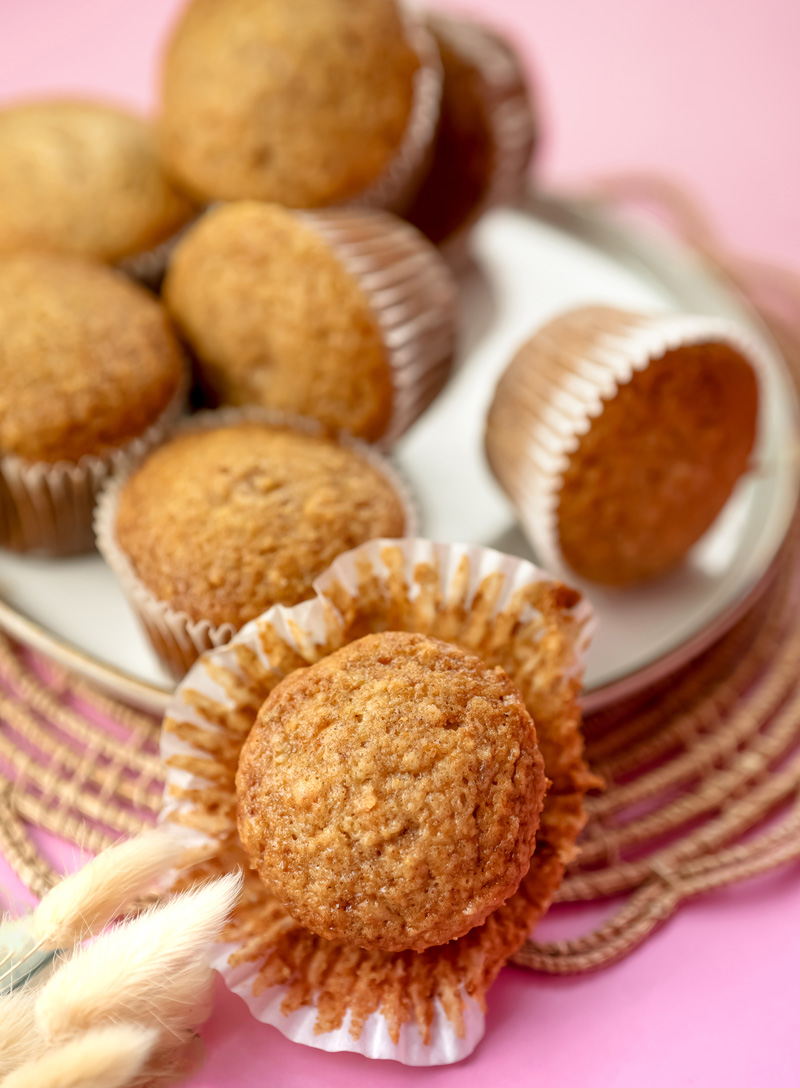 Close-up of moist applesauce muffin in paper liner