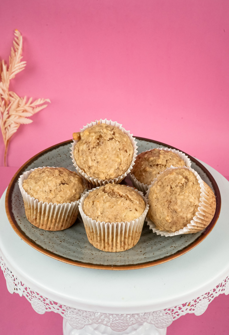 Warm oatmeal muffins with Eiffel Tower decoration in background