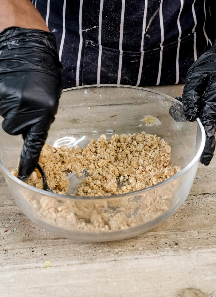 Mixing streusel topping for coffee cake muffins.