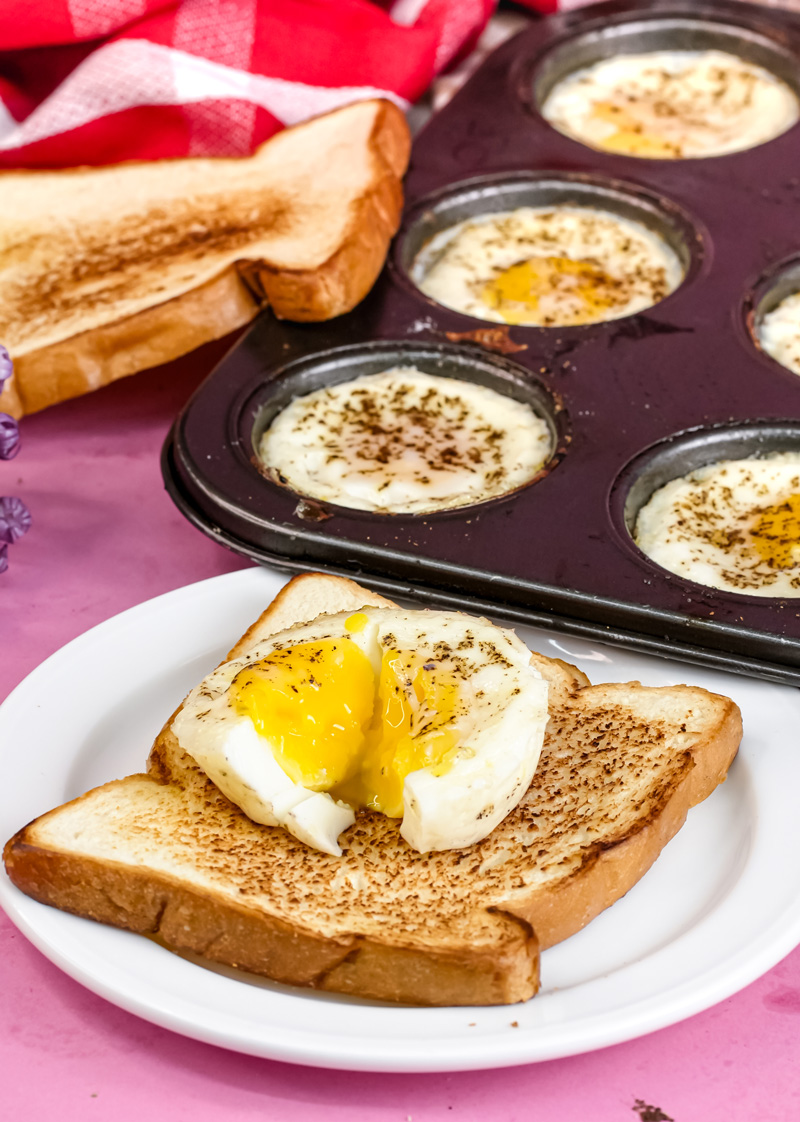 Seasoned muffin tin egg with flowing yolk on toast