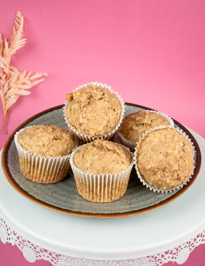 Homemade oatmeal muffins displayed on blue plate