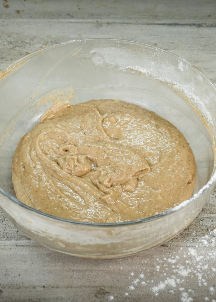 Well-mixed banana muffin batter ready for folding