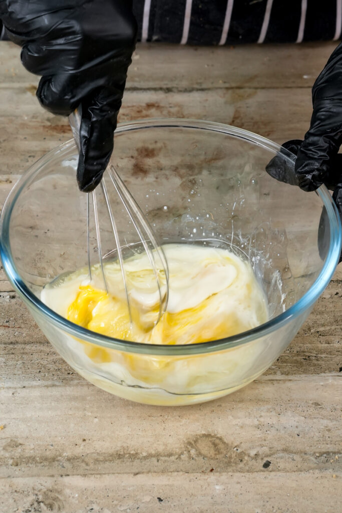 Whisking wet ingredients for pistachio muffin recipe