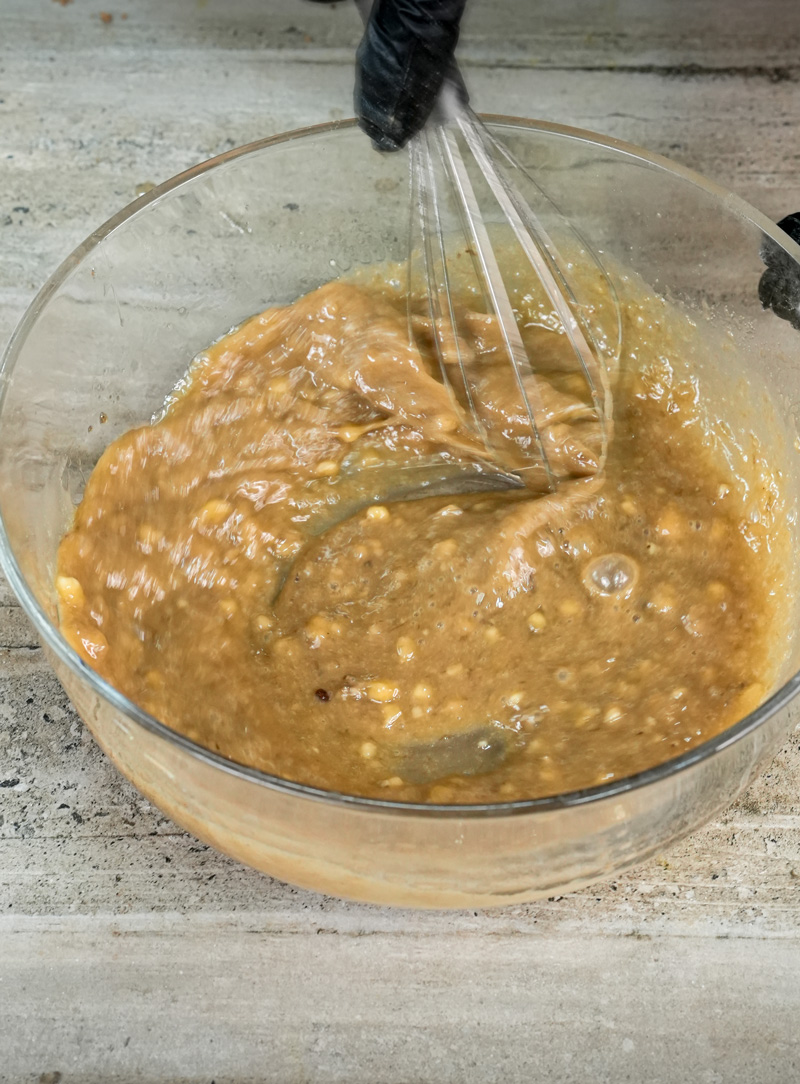 Whisking homemade banana muffin batter until smooth