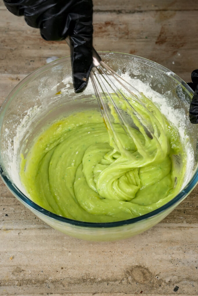 Whisking pistachio mixture into muffin batter