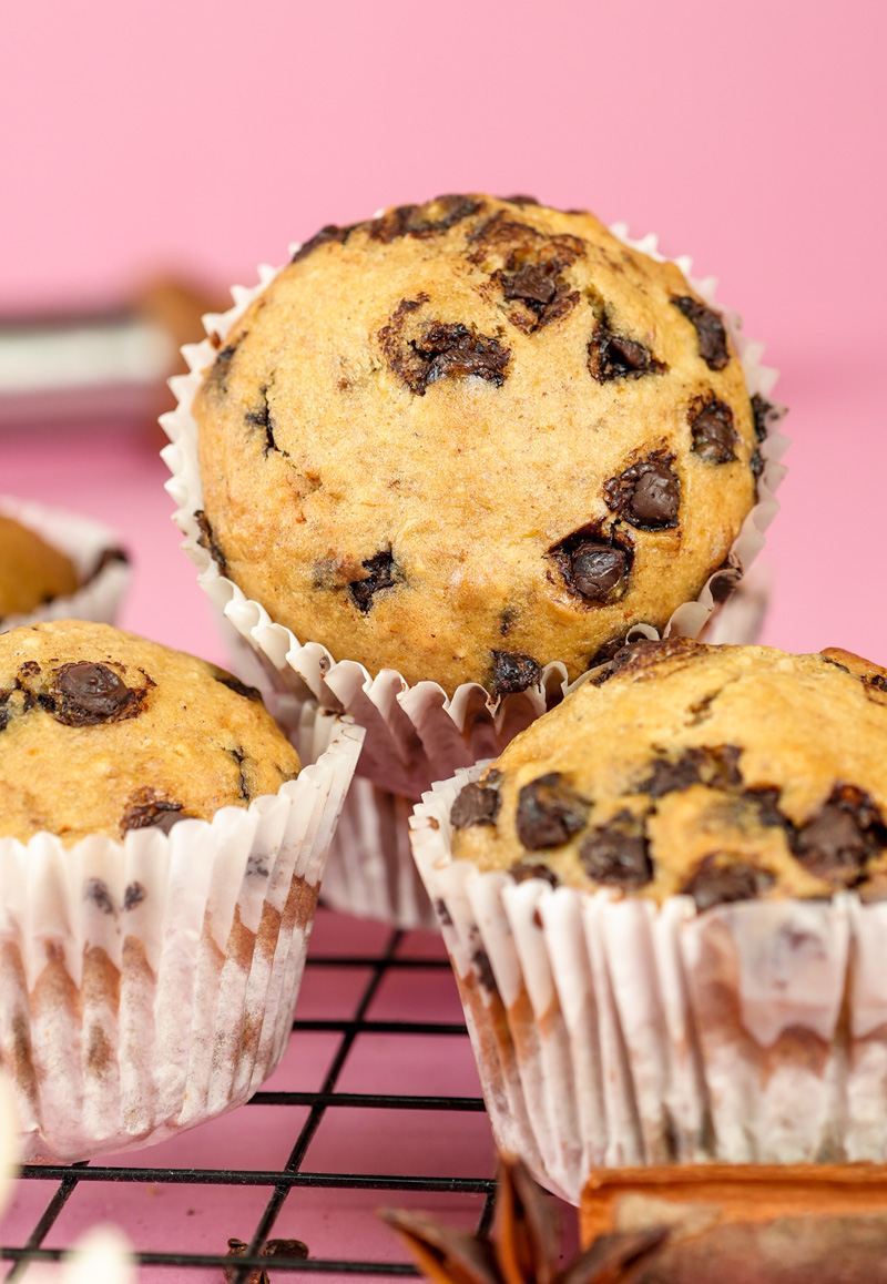 Golden-topped banana chocolate chip muffins with perfect dome shape