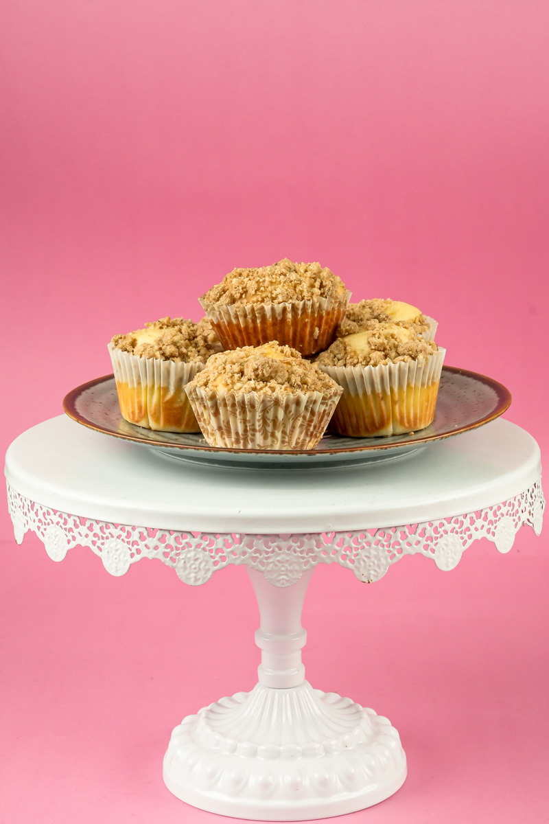 Finished coffee cake muffins on a serving plate.