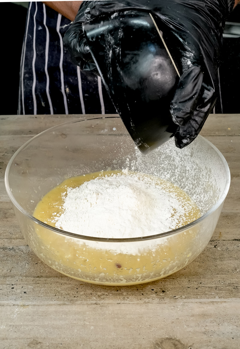 Incorporating flour into wet ingredients for applesauce oat muffins