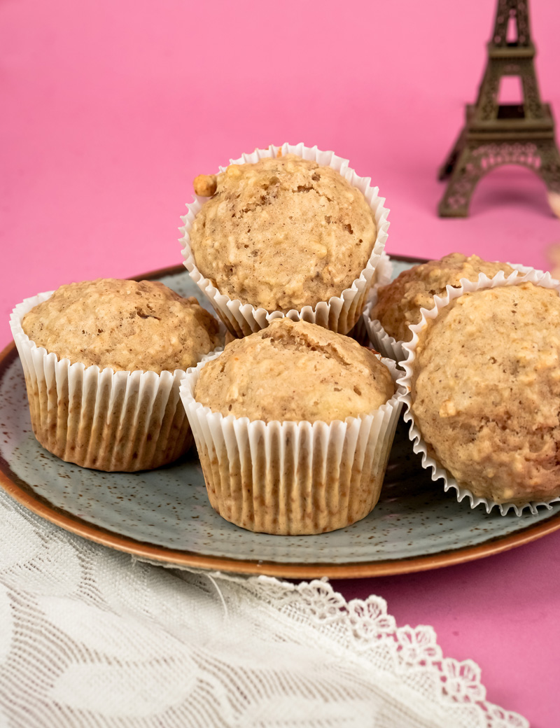 Stack of healthy oatmeal breakfast muffins on vintage plate
