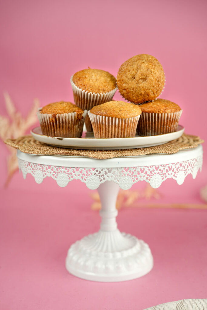 Homemade applesauce muffins on decorative cake stand