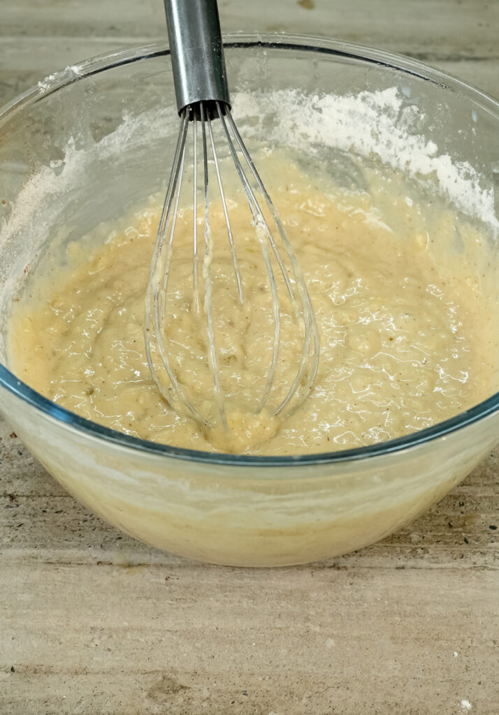 Perfectly mixed oatmeal muffin batter in glass bowl