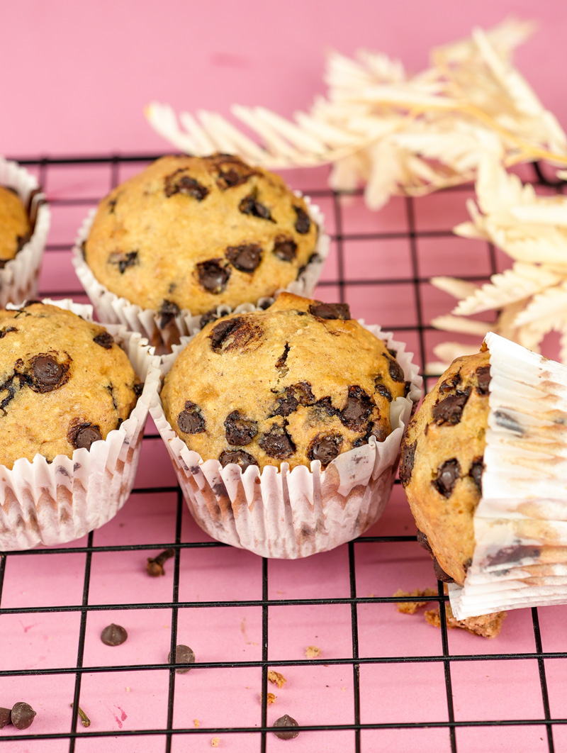 Batch of moist banana chocolate chip muffins with visible chocolate pieces