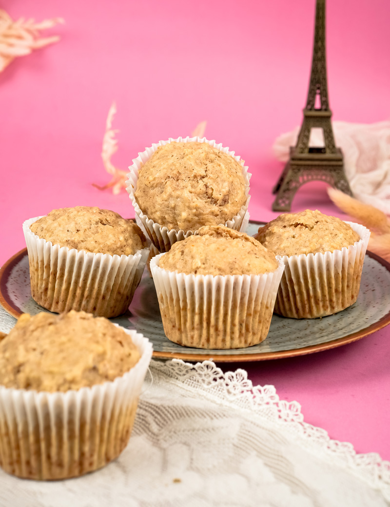 Close-up of fluffy oatmeal muffins with pink background