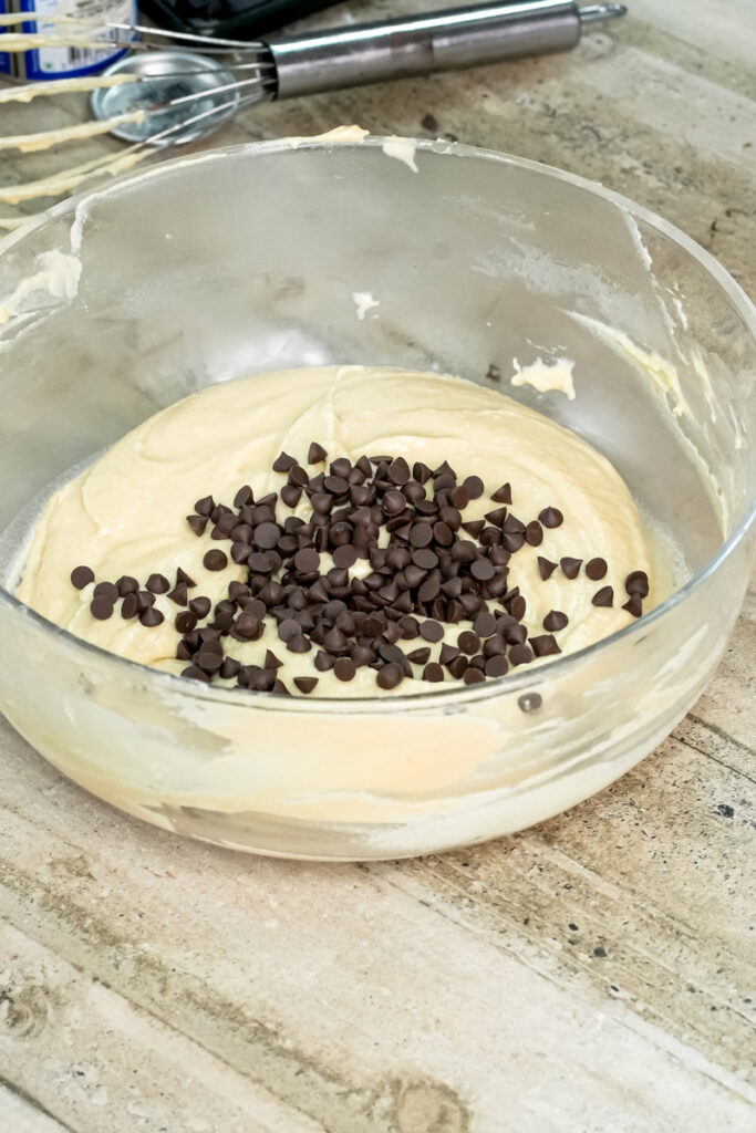 Adding chocolate chips to mini muffin batter