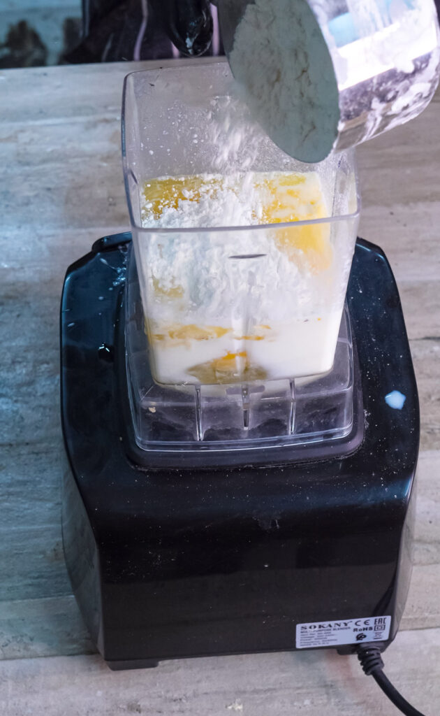 Adding flour to Dutch baby pancake batter in blender