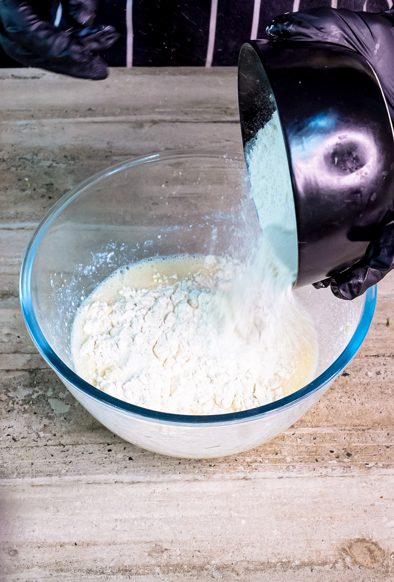 Adding flour to lemon ricotta pancake mixture