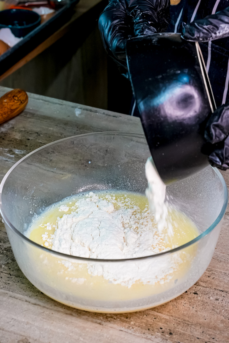 Adding flour to wet ingredients for silver dollar pancakes recipe