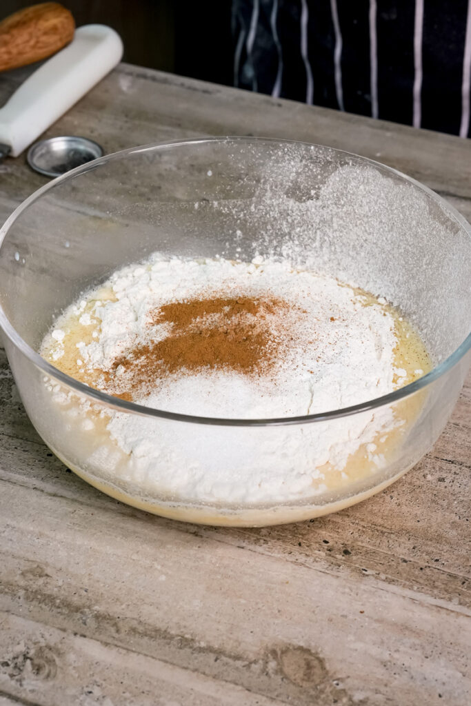 Adding ground cinnamon to pancake flour mixture