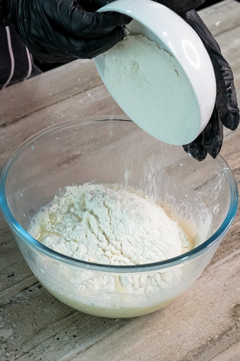 Adding milk mixture to flour for pancake roll recipe