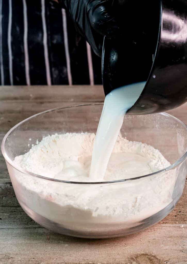 Adding milk to gluten-free pancake batter mixture