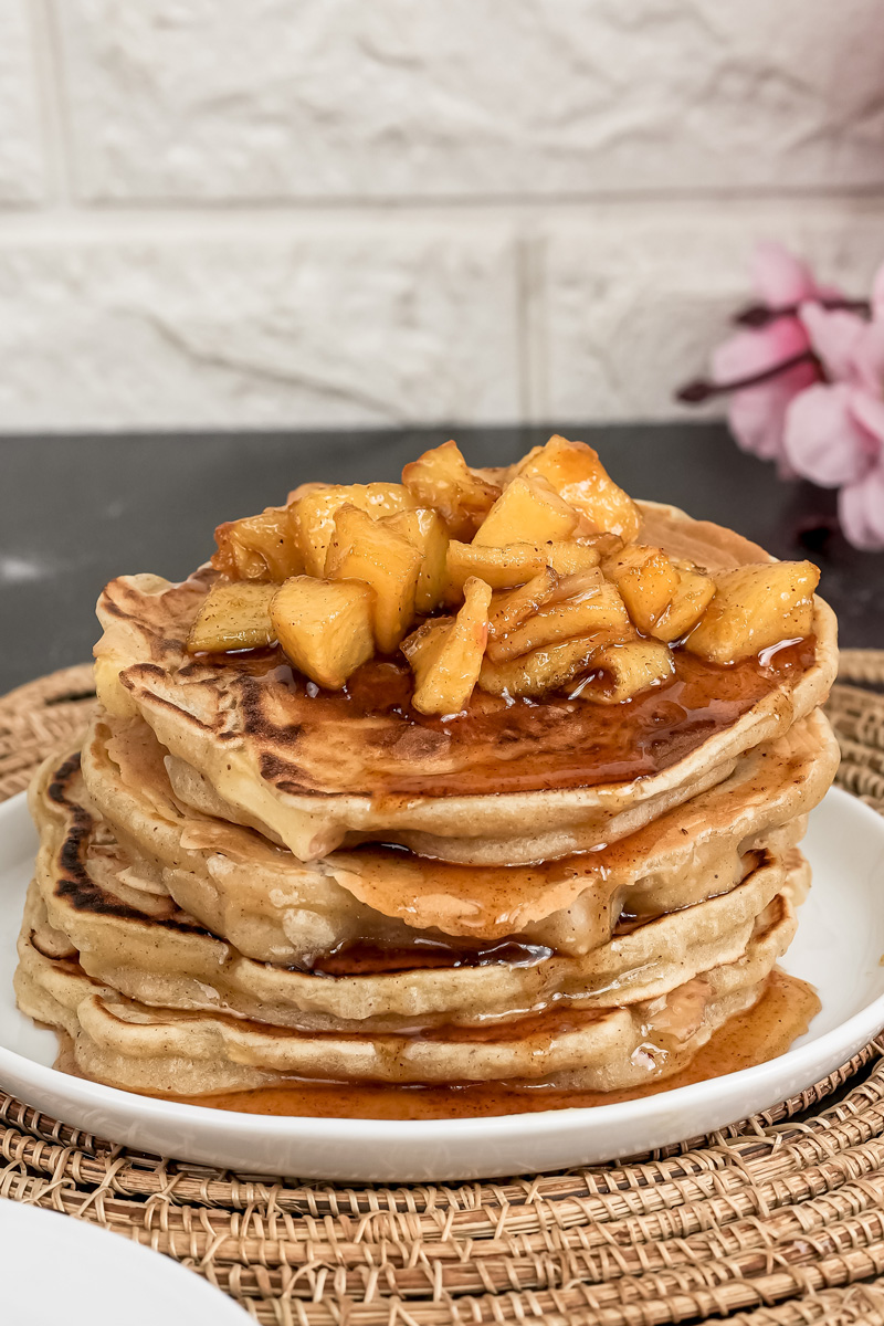 Apple cinnamon pancakes topped with caramelized apple pieces