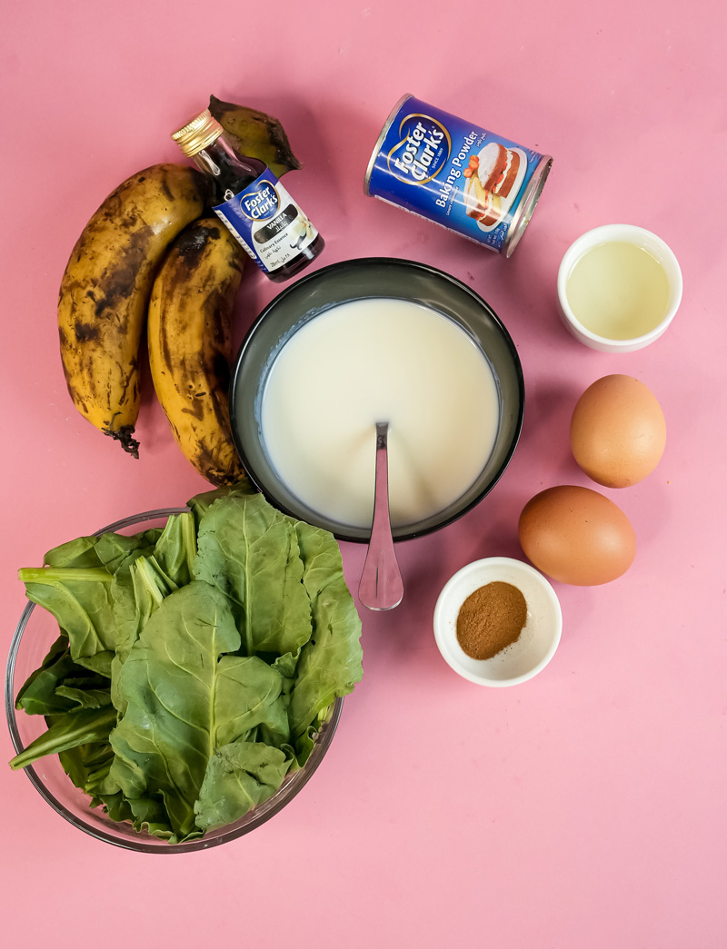Banana spinach pancake ingredients on pink background