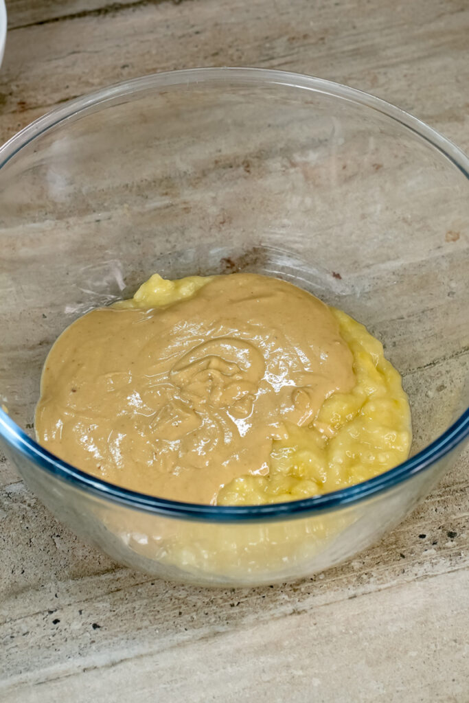 Combined wet ingredients for peanut butter banana muffins