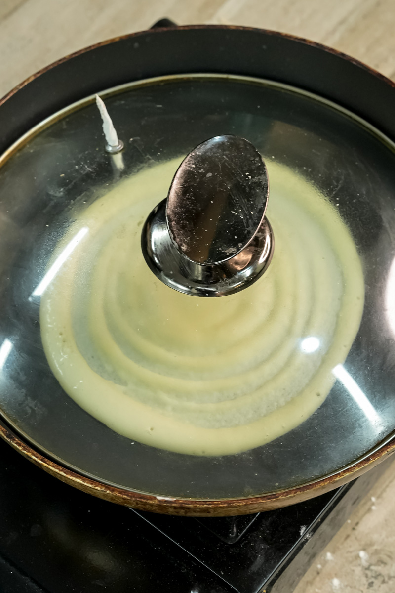 Cooking pancake roll in covered pan