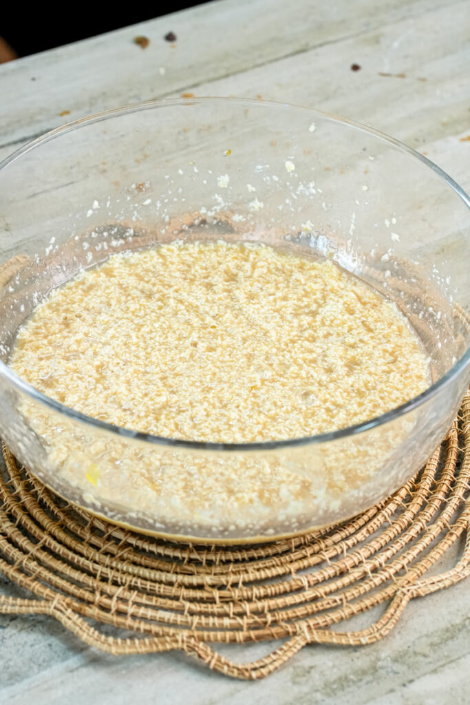 Smooth mini chocolate chip muffin wet mixture in glass bowl