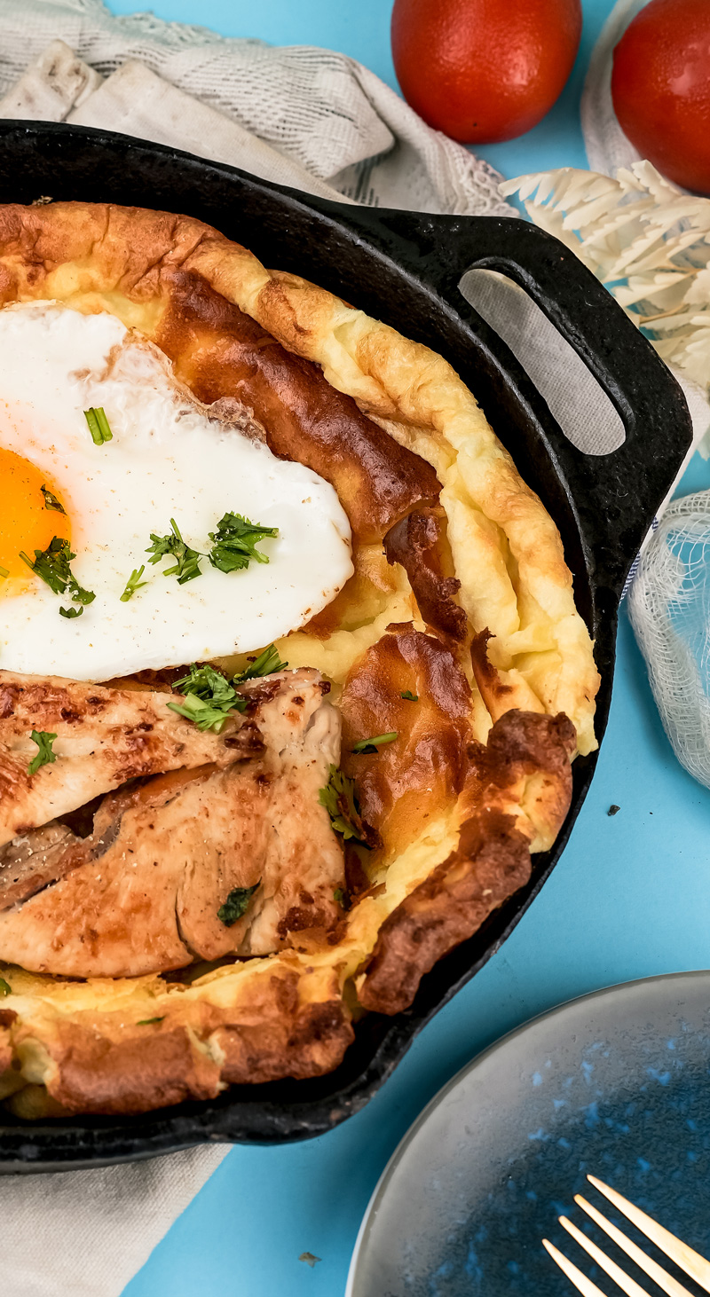 Crispy Dutch baby pancake edges with chicken and bacon toppings