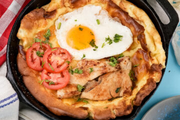 Dutch baby pancake with chicken, egg, tomatoes and fresh herbs