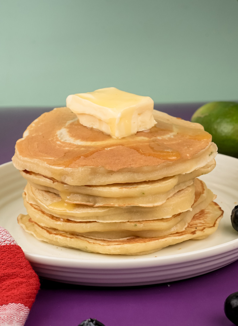 Fluffy lemon ricotta pancake stack with melting butter