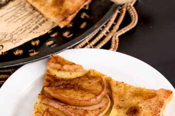 German Apple Pancake slice on white plate showing fluffy texture