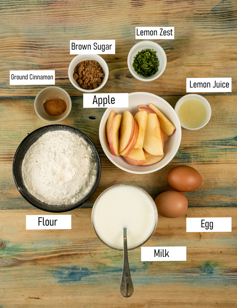 German Apple Pancake ingredients including flour, eggs, milk, apple slices, brown sugar and cinnamon