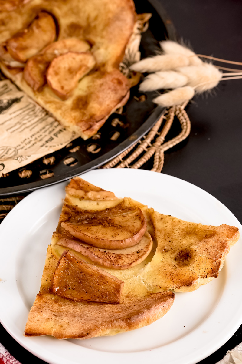 German Apple Pancake slice on white plate showing fluffy texture