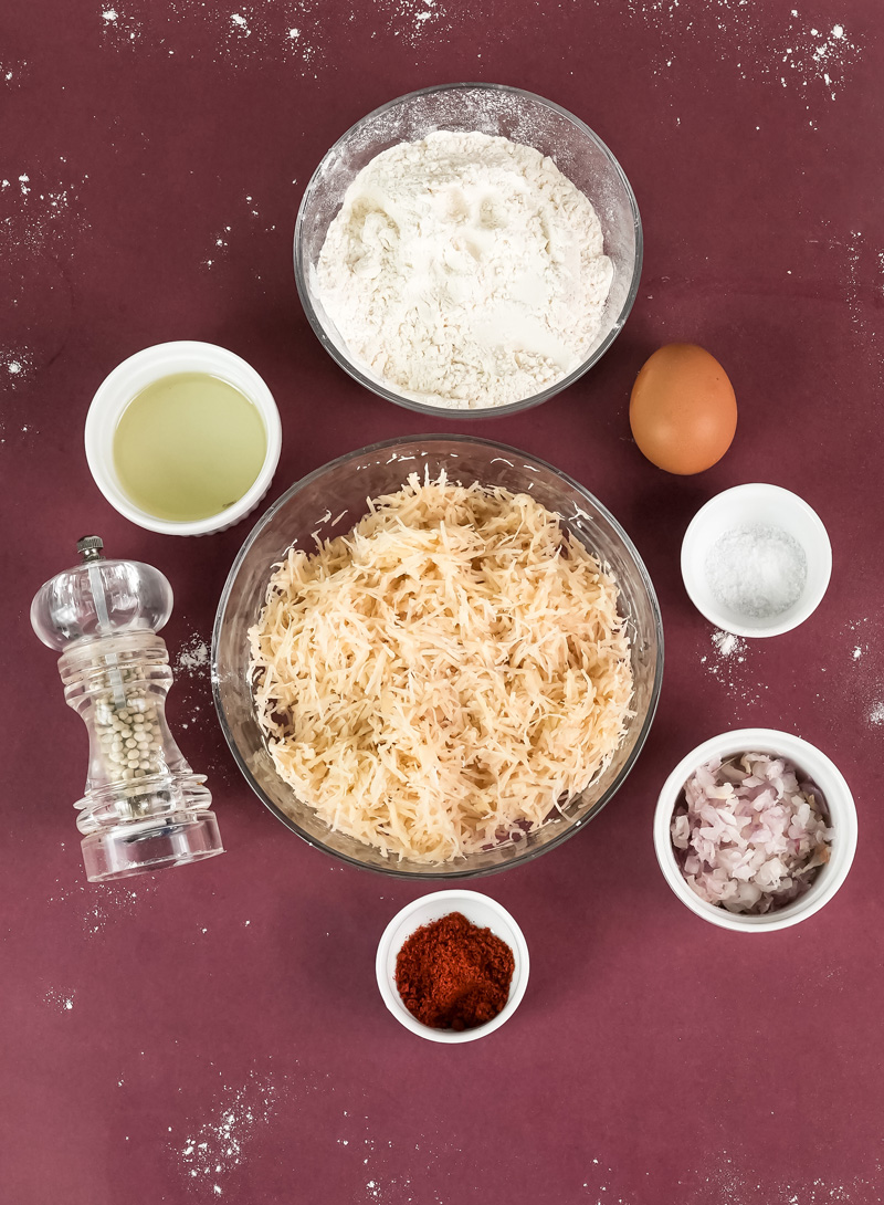 German potato pancake ingredients - flour, shredded potatoes, egg, onions, spices